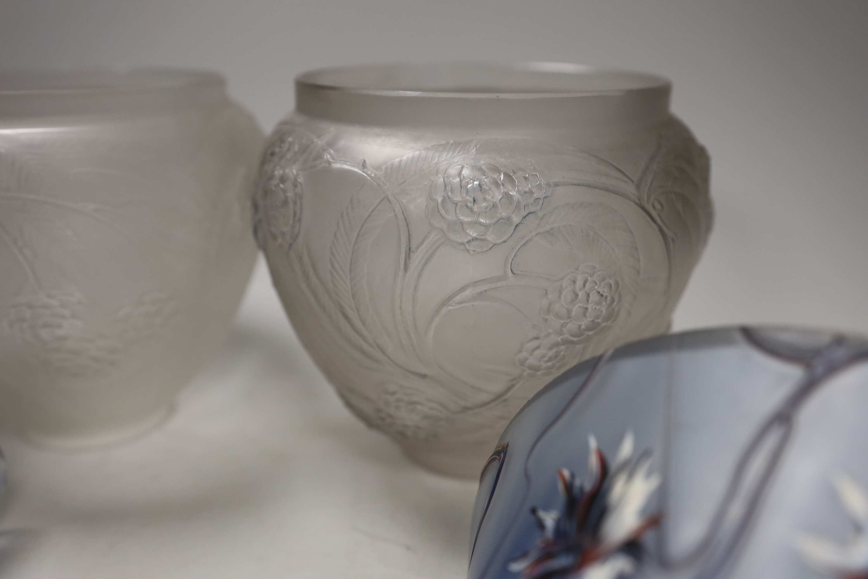 Two R. Lalique Nefliers vases, 14cm high, and a pair of blue enamelled glass wall pockets